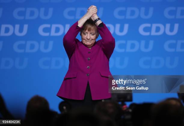 German Chancellor and Chairwoman of the German Christian Democrats Angela Merkel waves to delegates after she spoke at the 30th CDU party congress on...