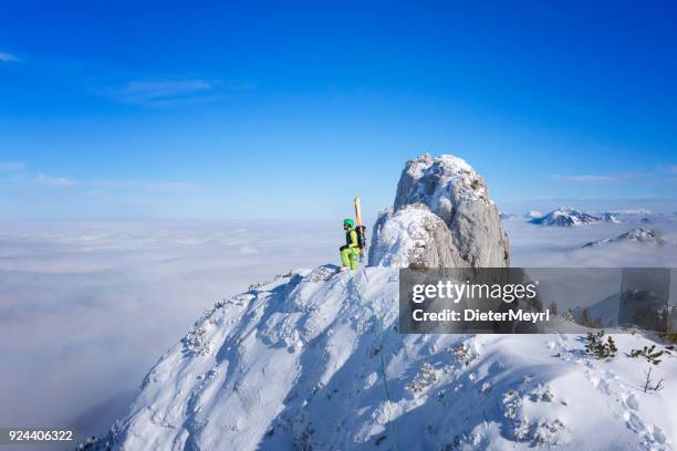 cross country skiier - freerider at the way to summit - mount kampenwand, alps - heli skiing stock pictures, royalty-free photos & images