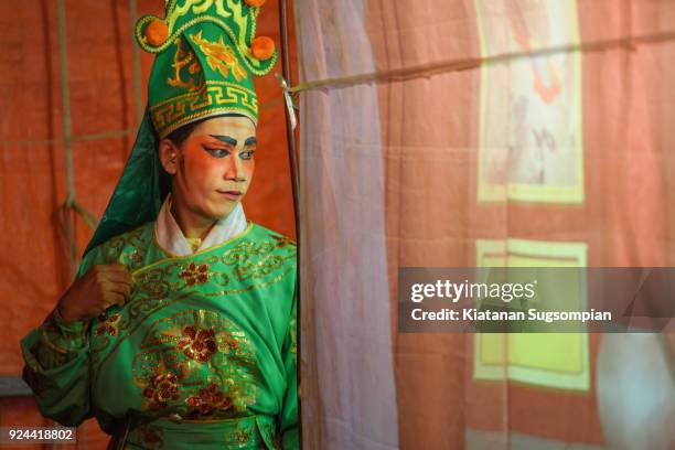 green chinese royal bodyguard - chinese opera in thailand stock pictures, royalty-free photos & images