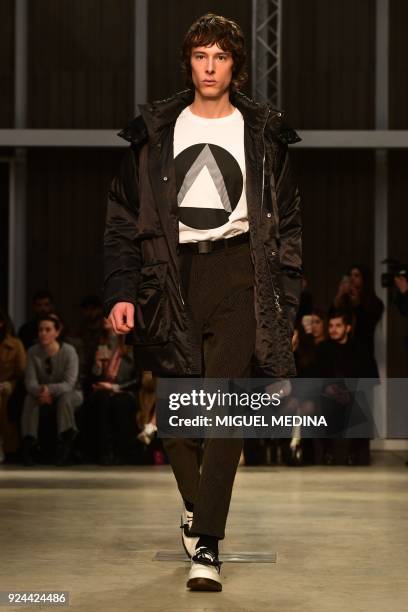 Model presents a creation by Atsushi Nakashima during the women's Fall/Winter 2018/2019 collection fashion show, in Milan, on February 26, 2018. /...