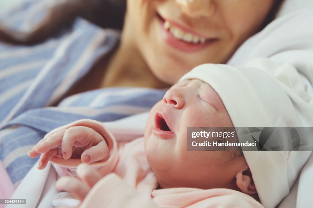 New born baby with his mother