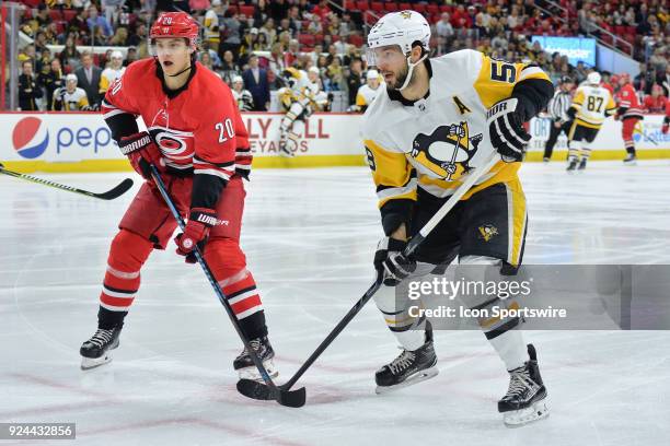 Carolina Hurricanes Left Wing Sebastian Aho and Pittsburgh Penguins Defenceman Kris Letang skates after a puck during a game between the Pittsburgh...