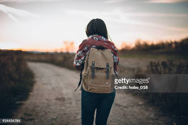 cute african woman hiking - back detail stock pictures, royalty-free photos & images