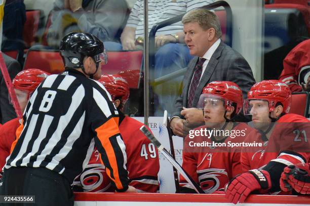 Referee Dave Jackson explains a call to Carolina Hurricanes head coach Bill Peters during a game between the Pittsburgh Penguins and the Carolina...