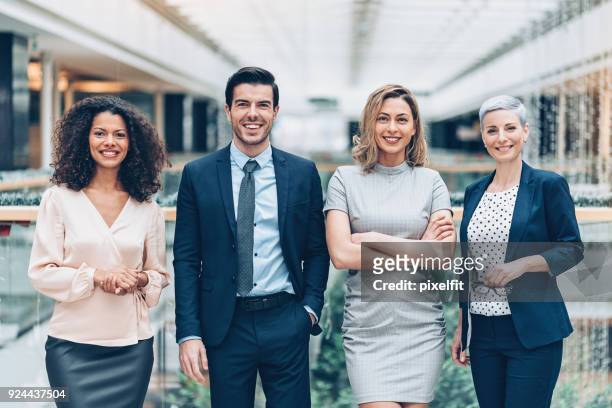 making business with confidence - business people in a row stock pictures, royalty-free photos & images