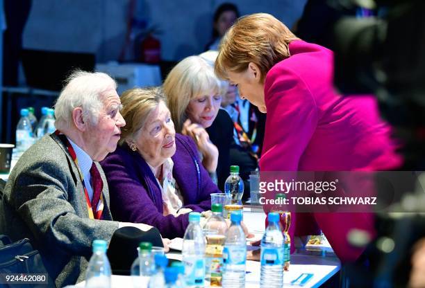 German Chancellor and leader of the conservative Christian Democratic Union party Angela Merkel talks with Saxony's former State Premier Kurt...