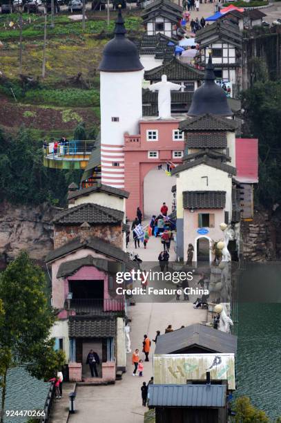 View of buildings of various styles on a 400-meter-long bridge in a tourism attraction in southwest China's Chongqing Municipality Friday Feb. 23,...