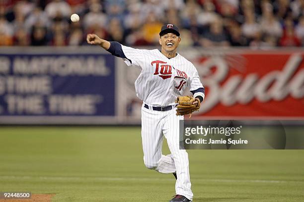 Shortstop Orlando Cabrera of the Minnesota Twins throws to make a play during the American League Tiebreaker game against the Detroit Tigers on...