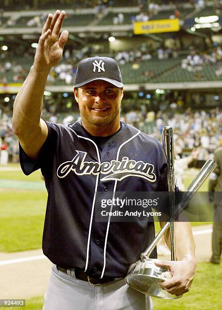 Jason Giambi of the New York Yankees acknowledges the crowd aftereing presented with the trophy after winning the MLB All Star Home Run Derby on July...