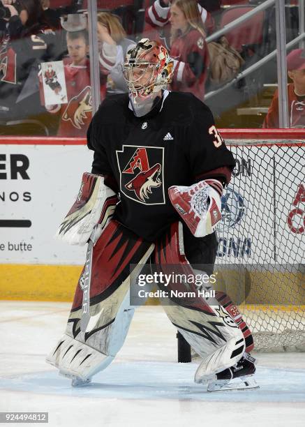 Antti Raanta of the Arizona Coyotes skates during pregame wearing a special Arizona Diamondbacks style warm up jersey prior to a game against the...