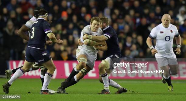 Joe Launchbury of England is tackled by John Barclay during the NatWest Six Nations match between Scotland and England at Murrayfield on February 24,...