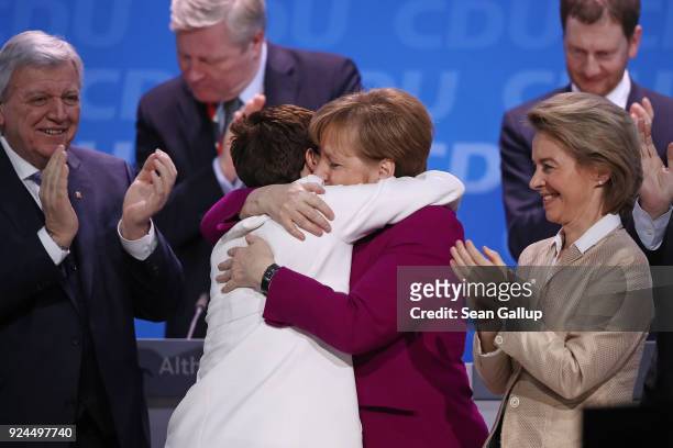 German Chancellor and Chairwoman of the German Christian Democrats Angela Merkel embraces Annegret Kramp-Karrenbauer moments after Kramp-Karrenbauer...