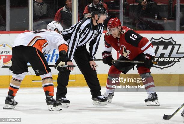Freddie Hamilton of the Arizona Coyotes gets ready to take a faceoff against Adam Henrique of the Anaheim Ducks at Gila River Arena on February 24,...
