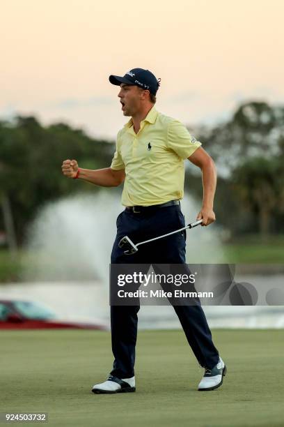 Justin Thomas reacts after a putt on the 18th green during the first playoff hole in the final round of the Honda Classic at PGA National Resort and...
