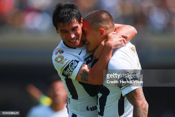 Nicolas Castillo of Pumas celebrates with teammate Matias Alustiza after scoring the first goal of his team during the 9th round match between Pumas...