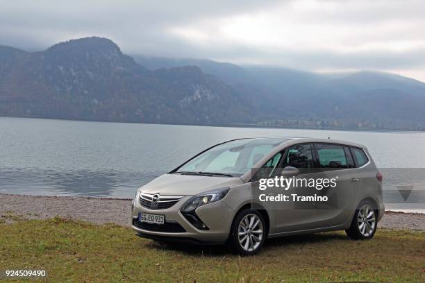 modern minivan parked near the lake - brandloch stock pictures, royalty-free photos & images