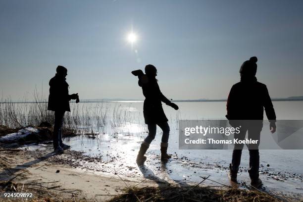 Glowe, Germany A family has fun at partially frozen Grosser Jasmunder Bodden near Glowe on the island Ruegen on February 09, 2018 in Glowe, Germany.