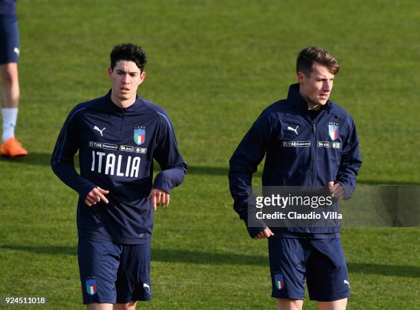 Alessandro Bastoni and Andrea Pinamonti of Italy look on during a training session at Italy club's training ground at Coverciano at Coverciano on...