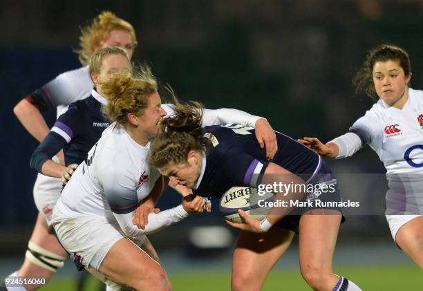 Amber Reid of England tackles Helen Nelson of Scotland during the Natwest Women's Six Nations match between Scotland Women and England Women at...