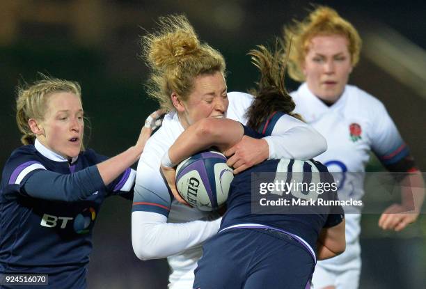 Amber Reid of England tackles Helen Nelson of Scotland during the Natwest Women's Six Nations match between Scotland Women and England Women at...