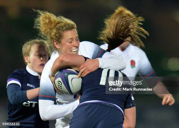 Amber Reid of England tackles Helen Nelson of Scotland during the Natwest Women's Six Nations match between Scotland Women and England Women at...