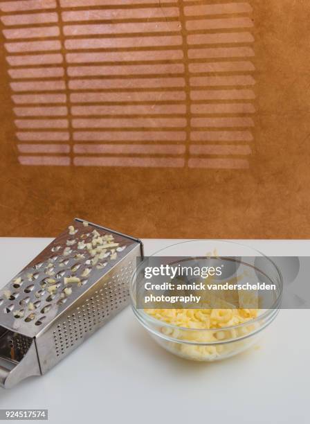 grated apples and grater. - grater stock pictures, royalty-free photos & images