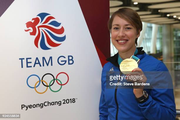 Lizzy Yarnold of Great Britain poses with her skeleton gold medal during the Team GB Homecoming from the Winter Olympics at Heathrow Airport on...