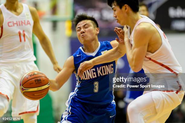 Man Hung Liang of Hong Kong in action against Qian Wu of China during the FIBA Basketball World Cup 2019 Asian Qualifier Group A match between Hong...