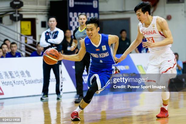Choi Kwan Tsai of Hong Kong in action against Qian Wu of China during the FIBA Basketball World Cup 2019 Asian Qualifier Group A match between Hong...