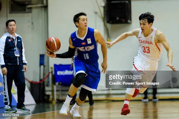 Adam Xu of Hong Kong in action against Qian Wu of China during the FIBA Basketball World Cup 2019 Asian Qualifier Group A match between Hong Kong and...