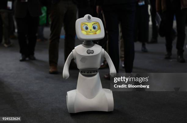 Robelf, a multi-camera home security robot, travels along the hall floor during the opening day of the Mobile World Congress in Barcelona, Spain, on...