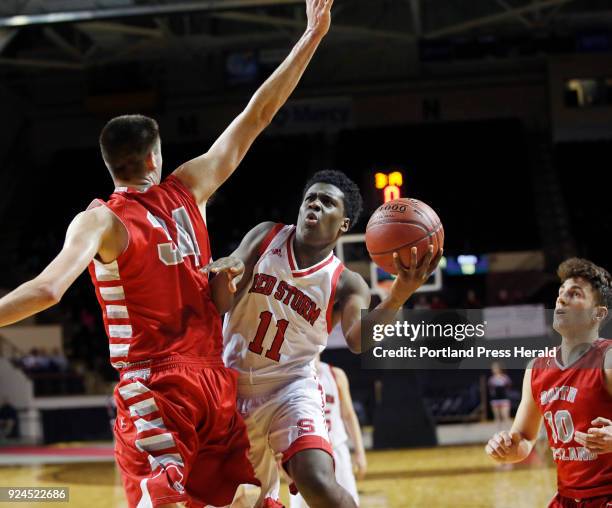 Scarborough vs South Portland Class AA South final. Jaquan Seme of Scarborough goes around Scott Lewis of South Portland to score in the first half.