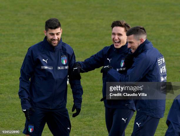 Marco Benassi, Federico Chiesa and Cristiano Biraghi of Italy smile during a training session at Italy club's training ground at Coverciano at...