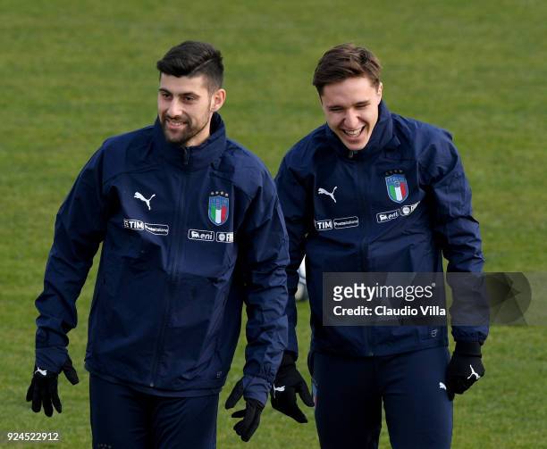 Federico Chiesa and Marco Benassi of Italy smile during a training session at Italy club's training ground at Coverciano at Coverciano on February...