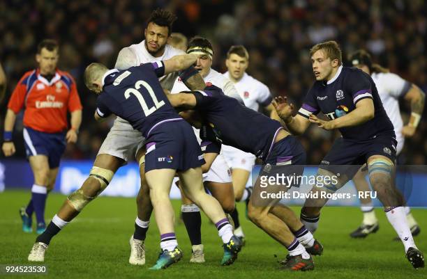 Courtney Lawes of England is tackled by Nick Grigg, Simon McInally and Jonny Gray during the NatWest Six Nations match between Scotland and England...