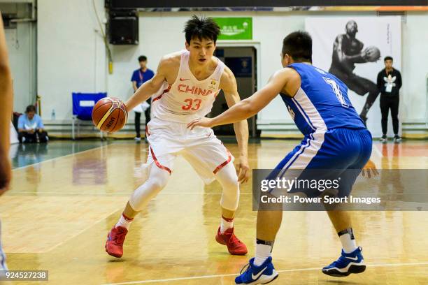 Qian Wu of China in action against Ki Lee of Hong Kong during the FIBA Basketball World Cup 2019 Asian Qualifier Group A match between Hong Kong and...