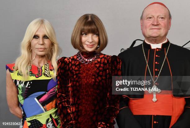 Italian designer Donatella Versace poses on February 26 with editor-in-chief of Vogue Anna Wintour and cardinal Gianfranco Ravasi, President of the...