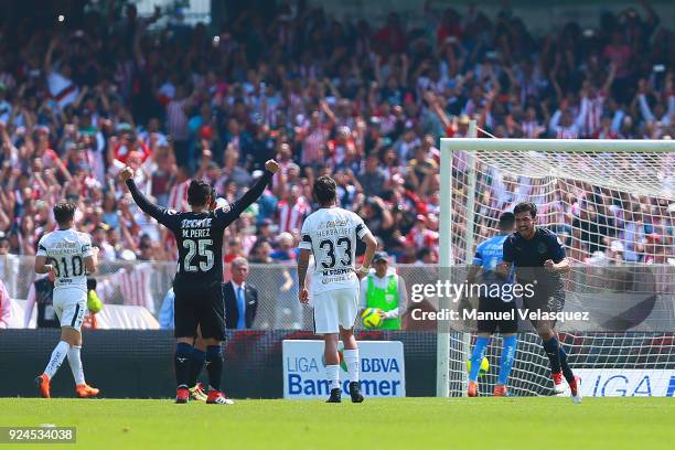 Oswaldo Alanis of Chivas celebrates after scoring teh first goal of his team during the 9th round match between Pumas UNAM and Chivas as part of the...