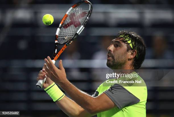 Marcos Baghdatis of Cyprus in action against Victor Troicki of Serbia during day one of the ATP Dubai Duty Free Tennis Championships at the Dubai...