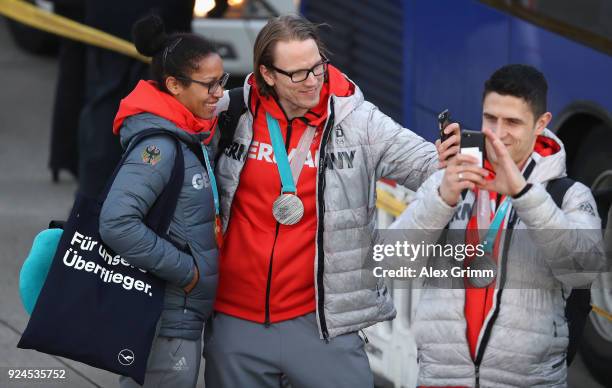 Mariama Jamanka and Christian Ehrhoff take a selfie during the welcome ceremony for the members of Team Germany after their return from the 2018...