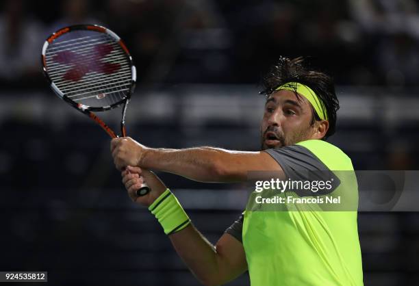 Marcos Baghdatis of Cyprus in action against Victor Troicki of Serbia during day one of the ATP Dubai Duty Free Tennis Championships at the Dubai...