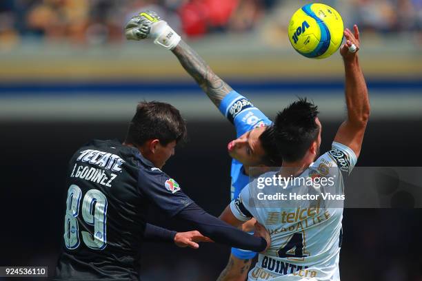 Luis Quintana of Pumas deflects the ball with his hand inside the area and the referee Cesar Ramos awards a penalty kick during the 9th round match...