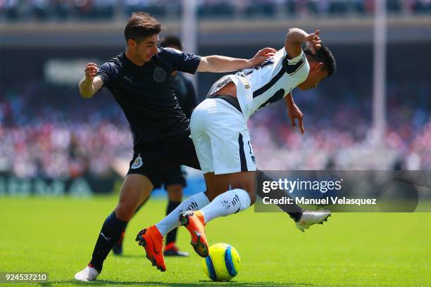 Jesus Gallardo of Pumas struggles for the ball with Isaac Brizuela of Chivas during the 9th round match between Pumas UNAM and Chivas as part of the...