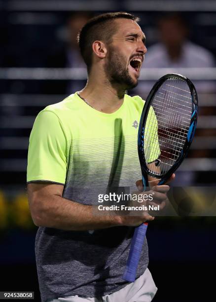 Viktor Troicki of Serbia reacts against Marcos Bagdatis of Cyprus during day one of the ATP Dubai Duty Free Tennis Championships at the Dubai Duty...