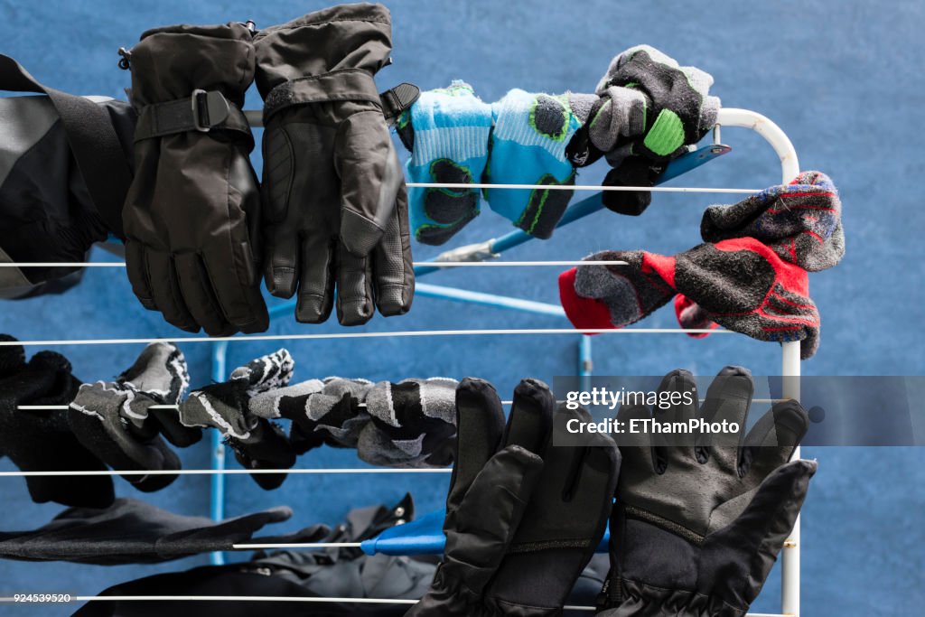 Ski equipment drying on a laundry rack inside appartment