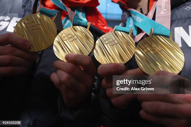 Luge doubles olympic champions Tobias Wendl and Tobias Arlt pose with their gold medals during the welcome ceremony for the members of Team Germany...