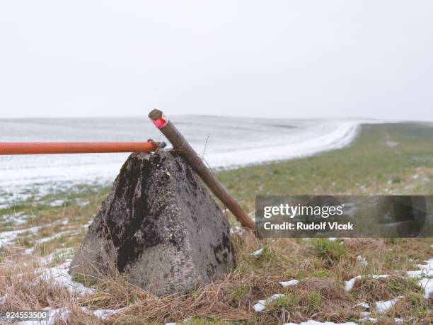 tranquil rural scene, winter field, boom barrier - boom barrier stock pictures, royalty-free photos & images