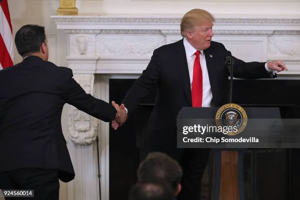 Nevada Governor Brian Sandoval shakes hands with U.S. President Donald Trump during a during a business session with state governors in the State...