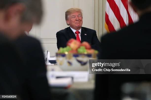 President Donald Trump hosts a business session with state governors in the State Dining Room at the White House February 26, 2018 in Washington, DC....