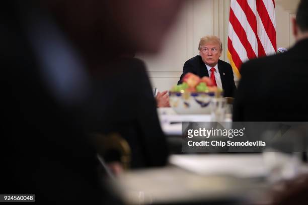 President Donald Trump hosts a business session with state governors in the State Dining Room at the White House February 26, 2018 in Washington, DC....